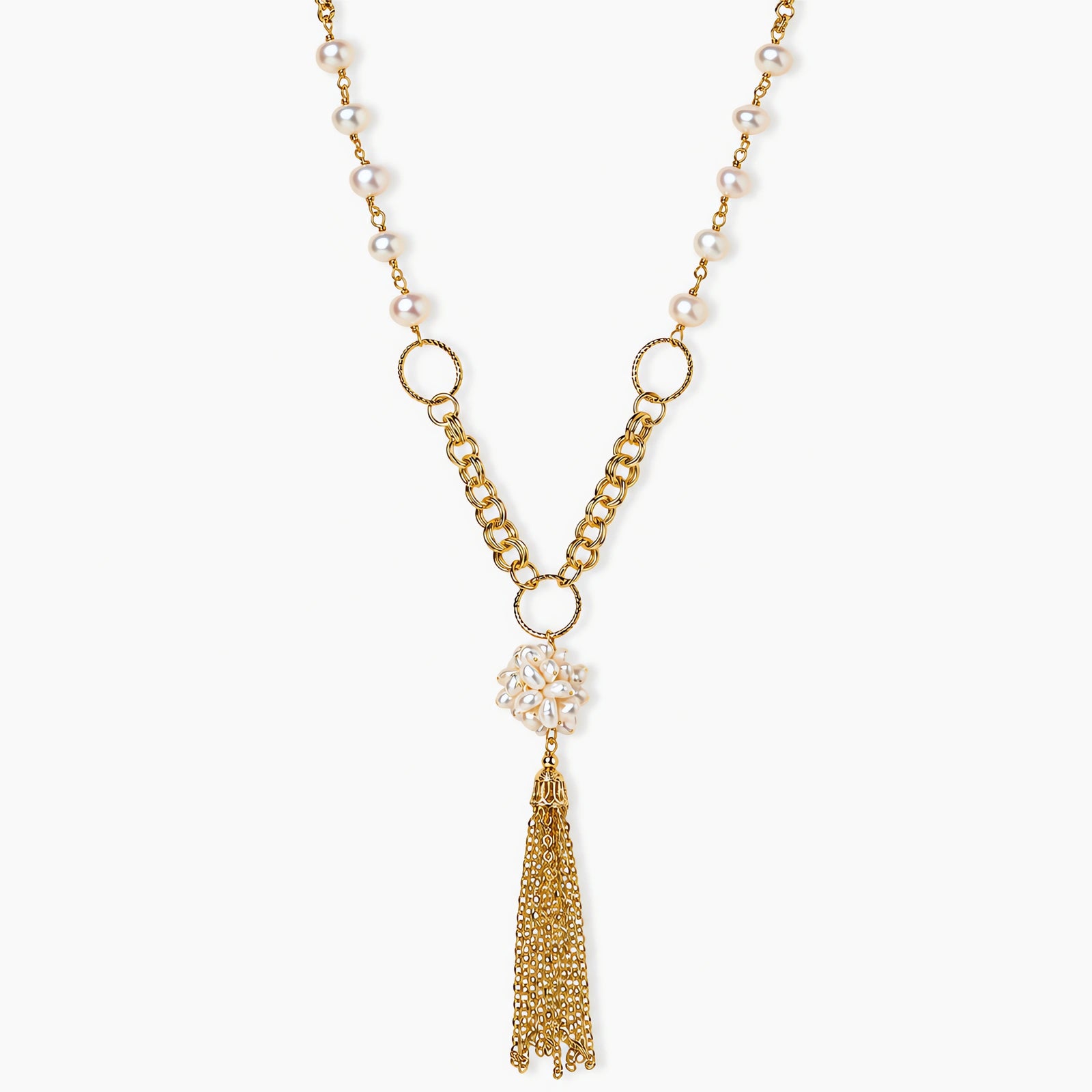 Long gold-plated necklace with freshwater pearls, chunky chain links, and flowing tassel pendant