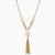 Long gold-plated necklace with freshwater pearls, chunky chain links, and flowing tassel pendant