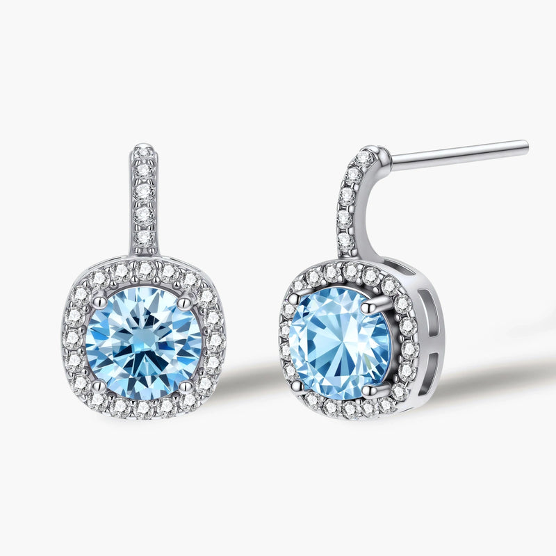 Sterling silver drop earrings featuring cushion-cut blue moissanite stones surrounded by sparkling halo settings