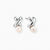 Rhodium-plated silver earrings with twisted X design and freshwater pearl drops on beige background