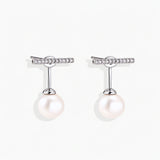 Rhodium-plated sterling silver ear jacket earrings with diamond-set horizontal bar and freshwater pearl drop