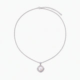 Cushion-shaped double halo pendant with 10mm freshwater pearl center on rhodium-plated sterling silver chain