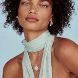 Cushion-shaped double halo pendant with 10mm freshwater pearl center on rhodium-plated sterling silver chain