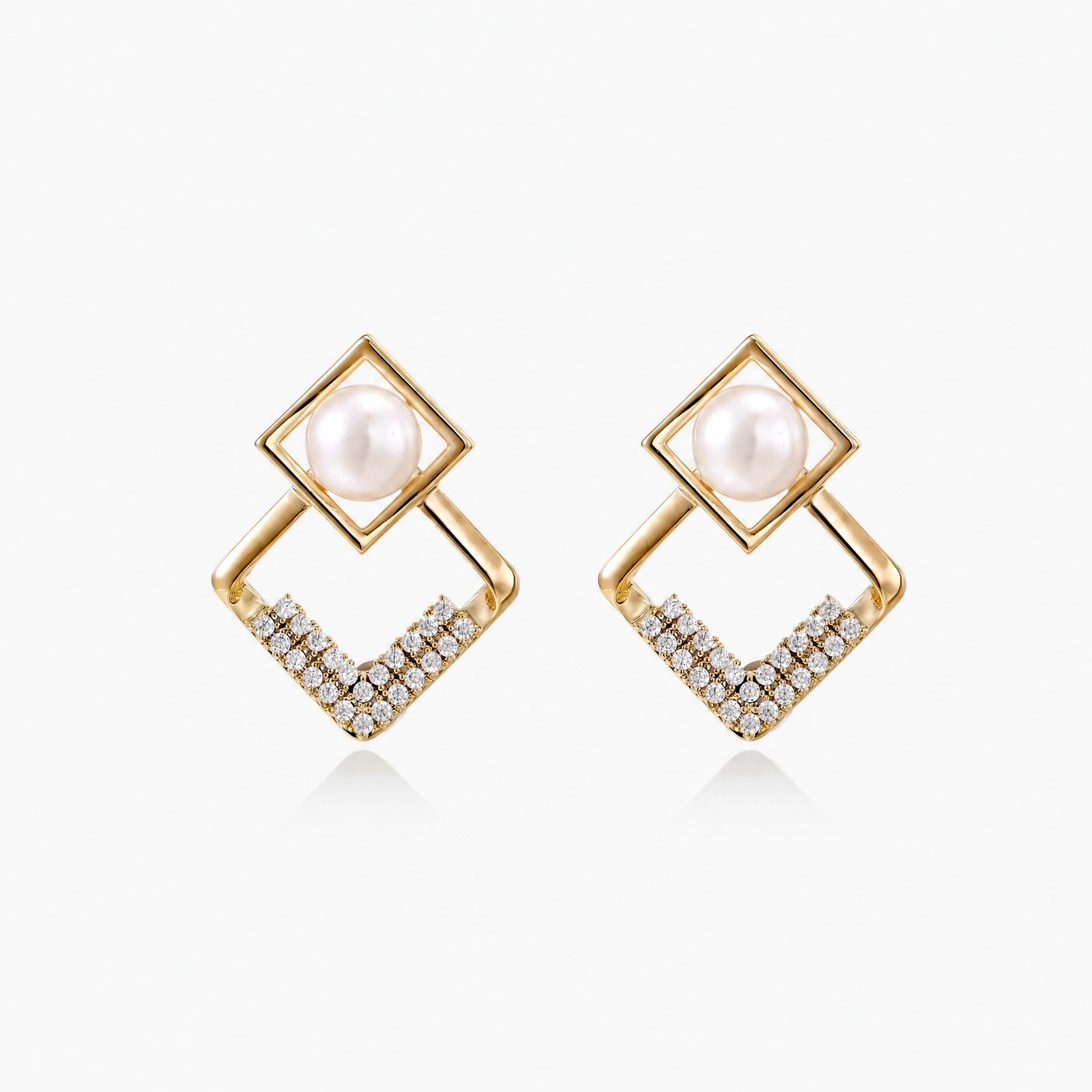 Gold-plated double square frame earrings with freshwater pearl and crystal accents on white background