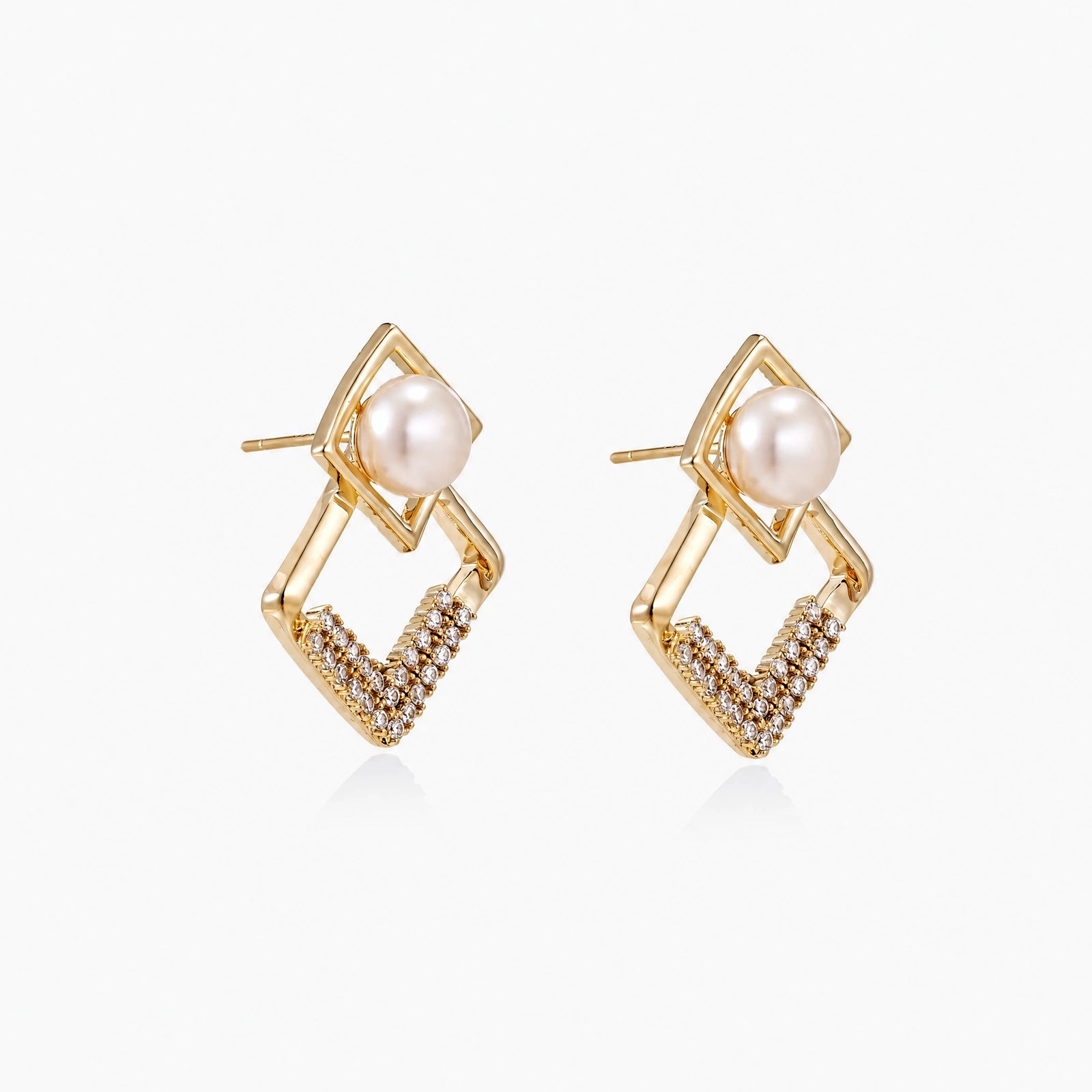 Gold-plated double square frame earrings with freshwater pearl and crystal accents on white background