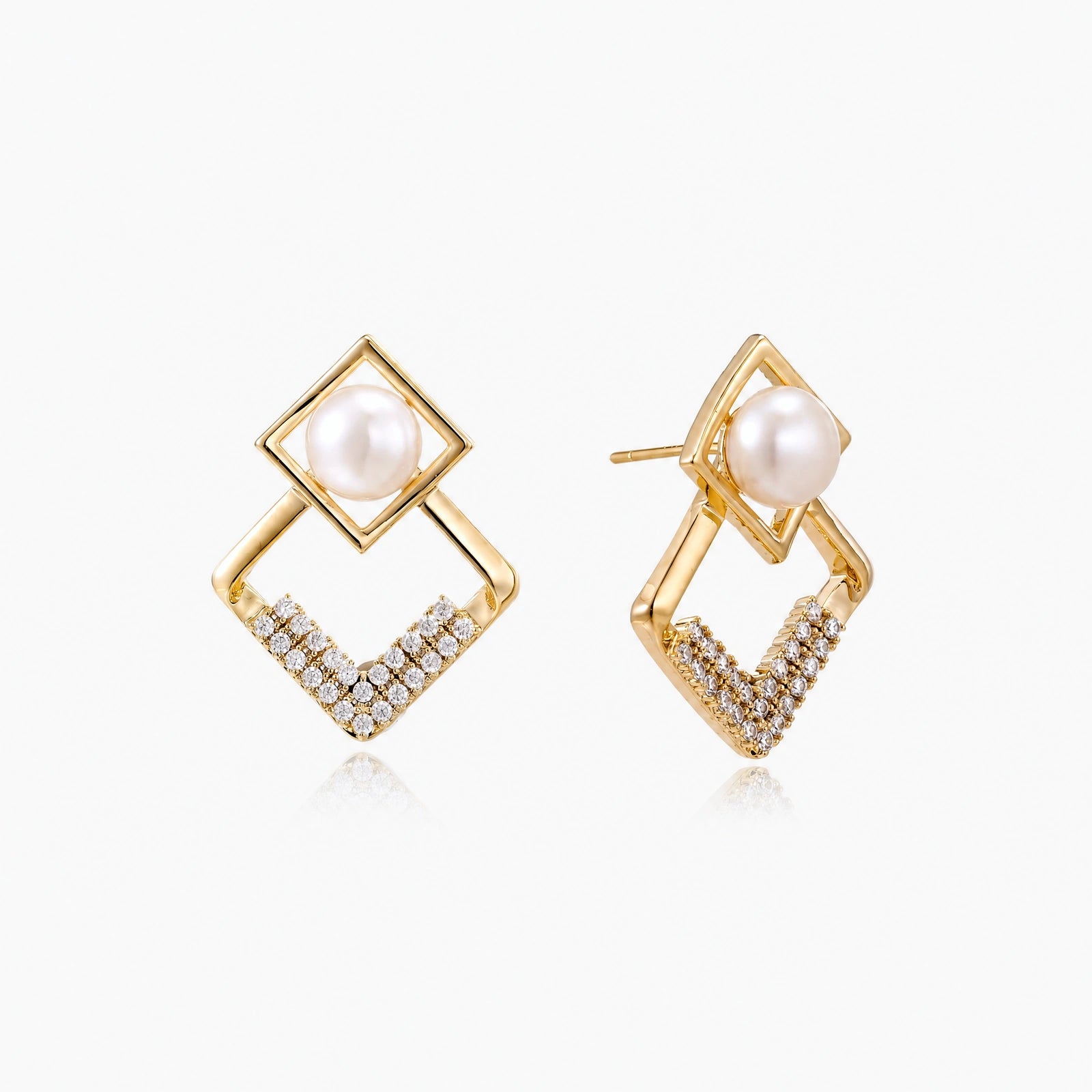 Gold-plated double square frame earrings with freshwater pearl and crystal accents on white background