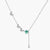 Sterling silver necklace with butterfly charms, green moissanite center stone, and teardrop crystal pendant on white background.