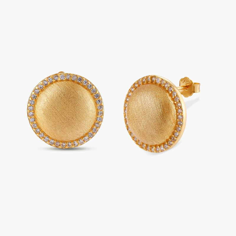 Pair of round dome stud earrings in brushed 18K gold-plated silver with a sparkling CZ halo border, push-back closure.