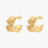 Pair of 18K gold-plated 925 sterling silver C-hoop earrings with brushed finish and scattered cubic zirconia clusters.
