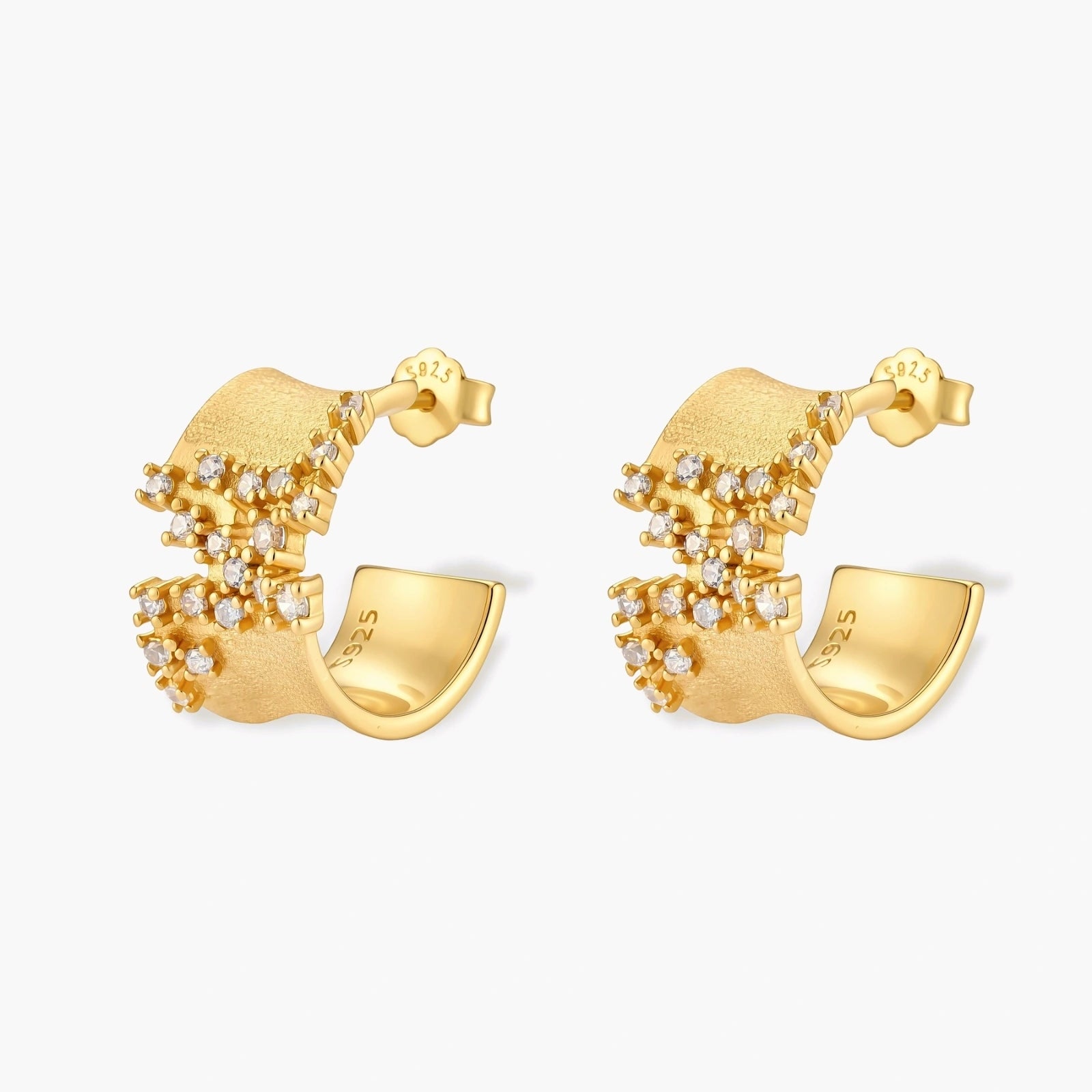 Pair of 18K gold-plated 925 sterling silver C-hoop earrings with brushed finish and scattered cubic zirconia clusters.