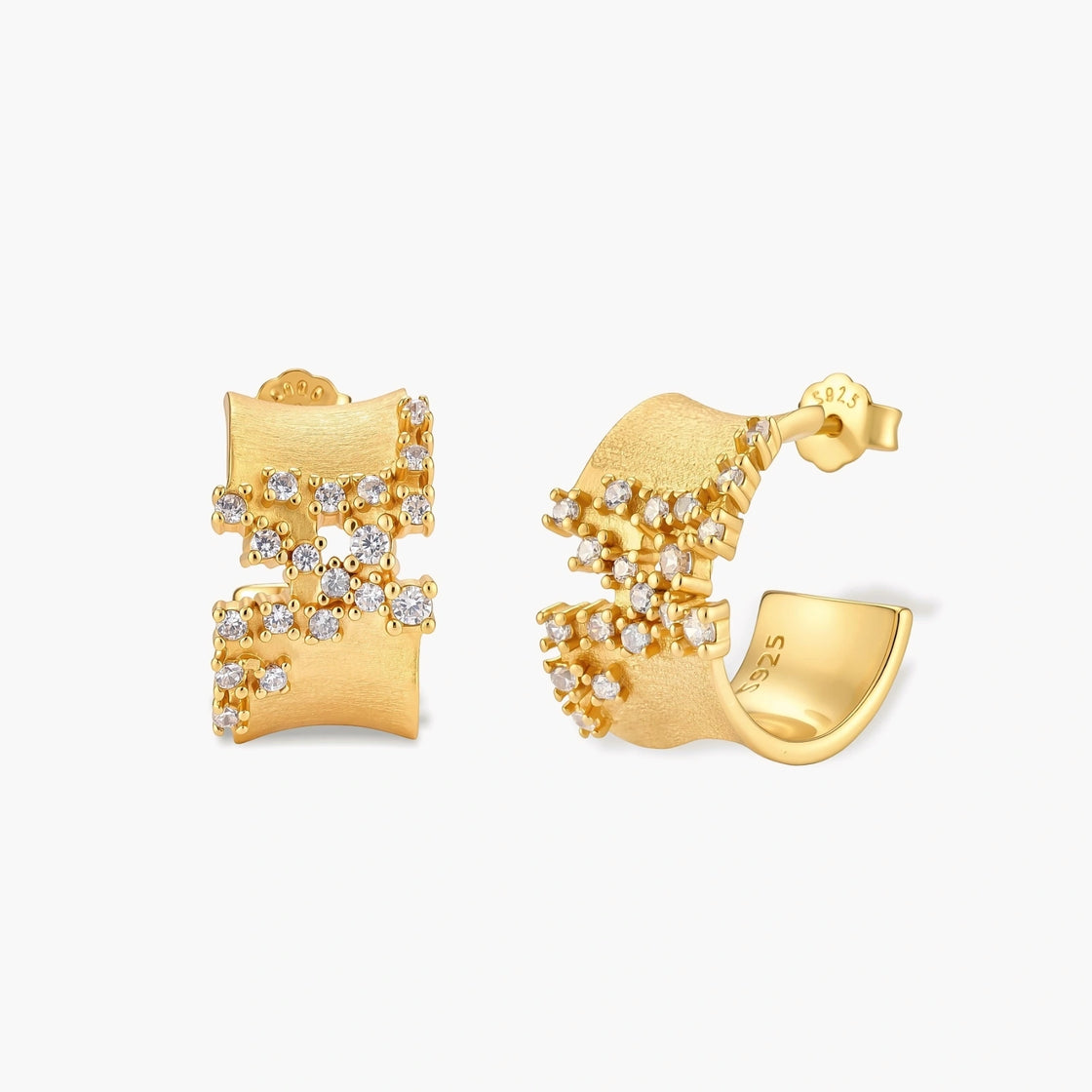 Pair of 18K gold-plated 925 sterling silver C-hoop earrings with brushed finish and scattered cubic zirconia clusters.