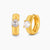 18K gold-plated 925 silver huggie hoops with brushed finish and prong-set round CZ solitaire, stamped S925 inside.