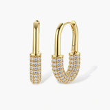 Gold-plated huggie hoop earrings with pavé zirconia stones covering the bottom curve, shown in open and closed positions.