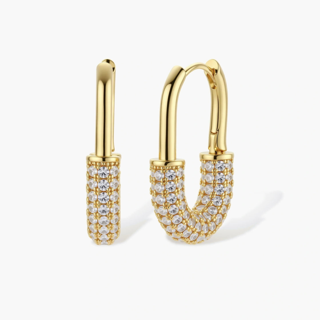 Gold-plated huggie hoop earrings with pavé zirconia stones covering the bottom curve, shown in open and closed positions.
