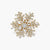 Geometric snowflake brooch with 14K gold-plated copper setting and clear zirconia crystals arranged in radiating pattern.