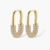Gold-plated huggie hoop earrings with pavé zirconia stones covering the bottom curve, shown in open and closed positions.