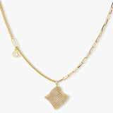 Gold-plated wavy jewelry set with crystal detailing featuring necklace with dual chains and matching textured earrings